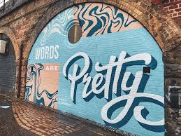 Clean air mural painted on an enclosed brick railway arch